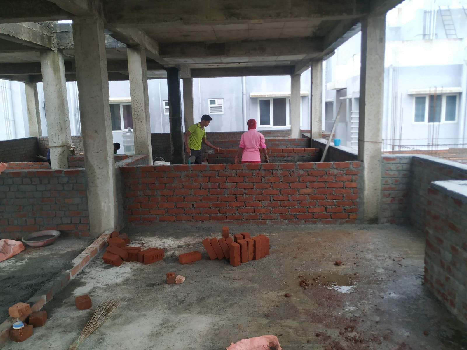Construction workers actively working at site
