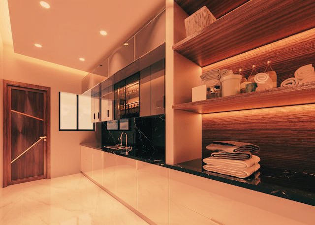 Spacious contemporary home interior featuring open-plan kitchen, island counter, wooden accents, and large glass doors with natural light